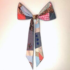 Urban Outfitters Remnants Patchwork Bow Wall Hanging